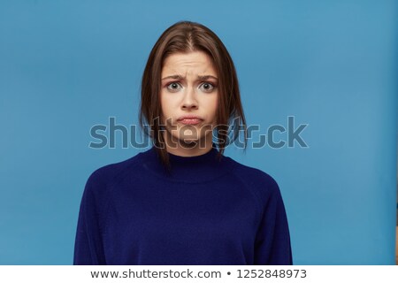 Foto d'archivio: Portrait Of An Upset Young Woman Dressed In Sweater