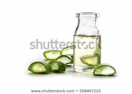 [[stock_photo]]: Slices Of A Aloe Vera Leaf And A Bottle With Transparent Gel For Medicinal Purposes Skin Treatment