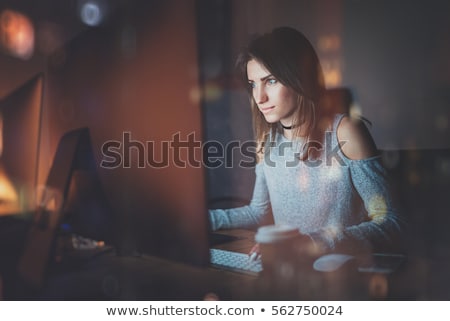 Stock photo: Businesswoman With Papers Working At Night Office