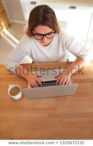 Stock photo: Top View Of Womans Hands Typing On Laptop Keypad Wearing Glasses