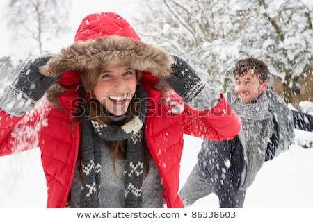 Stock fotó: Young Couple Having Snowball Fight