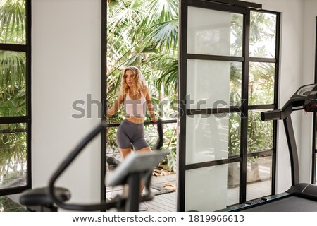 Stockfoto: Pretty Woman Listening To Music Standing On The Balcony