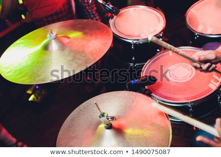 Foto d'archivio: Silhouette Of Man Drummer Sitting And Playing Drums With Sticks