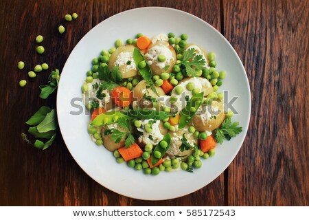 Stock foto: Potato Salad With Carrots Peas And Coriander
