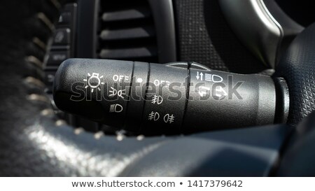 [[stock_photo]]: Headlight Of The Main Light Of The Black Car Close Up