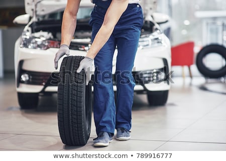 Foto stock: Car In A Garage For Maintenance Oiltyre Change