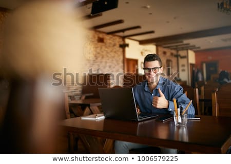 Stock photo: Smiling Young Businessman Doing Sit Ups