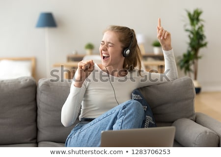 [[stock_photo]]: Music Fun For Teenage Girl Singing With Headphones