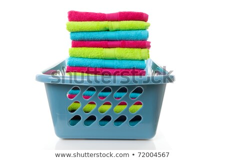 Сток-фото: Laundry Basket Filled With Colorful Folded Towels