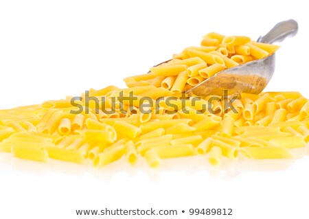Penne Pasta Flowing From A Scoop Stockfoto © Calvste