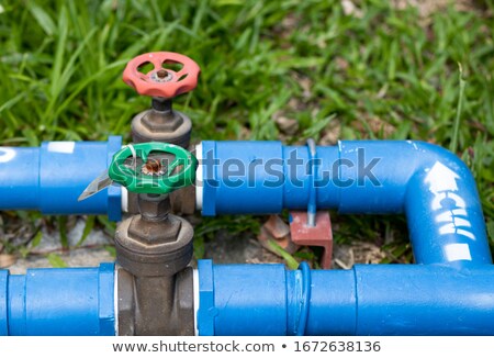 ストックフォト: Old Plumbing Pipes With Valves Closeup Front