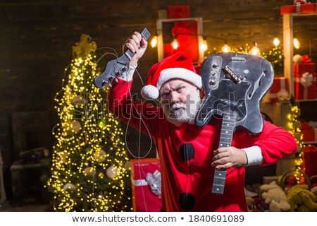 Сток-фото: Christmas Santa Man With Electric Guitar