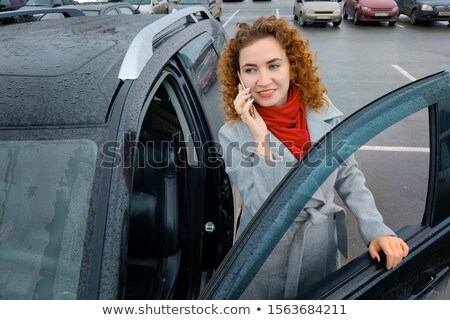 Stock fotó: Pretty Young Business Woman Standing Near Her Car On Parking