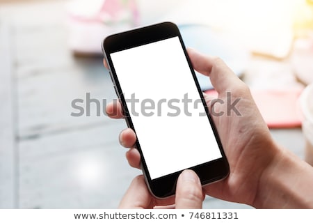 Foto stock: Young Man Using Mobile Phone On White Background