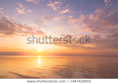 ストックフォト: Sunset In The Sky With Blue Marine Clouds