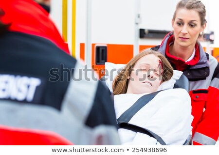 ストックフォト: Emergency Doctors Transporting Man On Stretcher