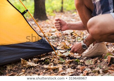 Foto stock: Setting Up A Tent