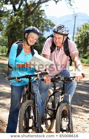 Сток-фото: Couple With Map And Bicycles At Country In Summer