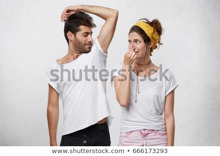 ストックフォト: Man Looking At His Sweaty Armpit