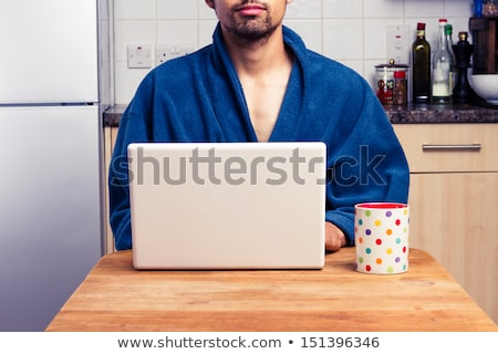 Foto stock: Man Working In Dressing Gown