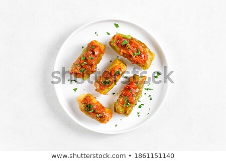 Foto d'archivio: Stuffed Cabbage Over Red Plate