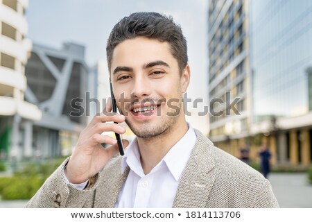 Young Happy Businessman Against His Office Building Сток-фото © Pressmaster