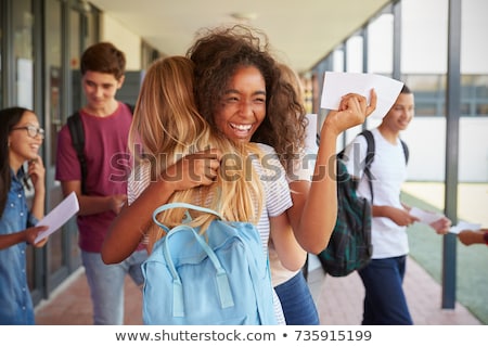 Foto stock: Two Teenage Girls Celebrating Successful Exam Results