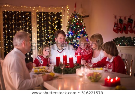 Stockfoto: Big New Year Candle And Festive Wreath