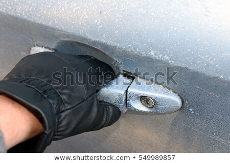 Foto stock: Icy Grip Of The Car Door