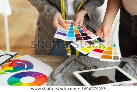 [[stock_photo]]: Crop Seamstress Choosing Fabric For Dress