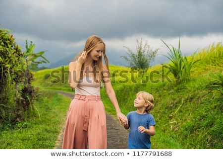 ストックフォト: Mom And Son Travelers On Beautiful Jatiluwih Rice Terraces Against The Background Of Famous Volcanoe