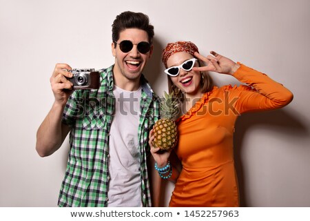 Foto stock: Beautiful Girlfriends In Sunglasses Showing Peace Signs At Camera With Smile