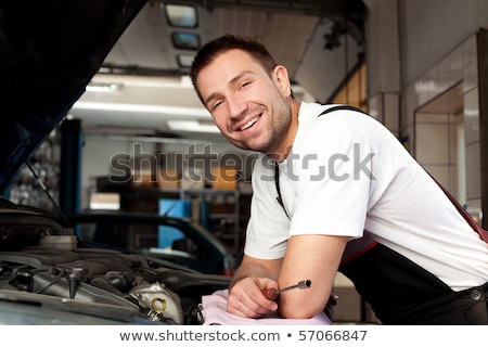 Сток-фото: Handsome Mechanic Based On Car In Auto Repair Shop