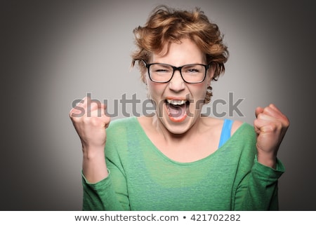 Stock photo: Young Woman Clenching Her Fist