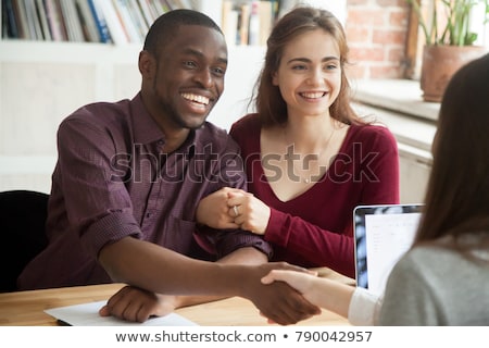 Stock fotó: Smiling Lawyer Offering Handshake At Desk