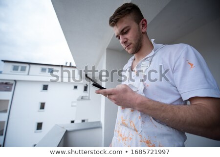 Painter Making Telephone Call Foto stock © dotshock