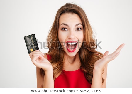 Foto stock: Cheerful Young Woman Holding Gifts