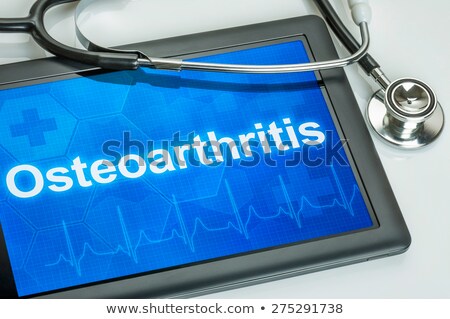 ストックフォト: Tablet With The Diagnosis Joint Pain On The Display