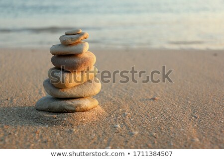 Stock foto: Balancing Zen Stones Pyramid On Sandy Beach