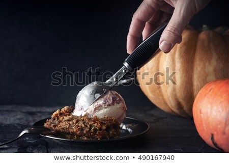 Stockfoto: Pumpkin Dump Cake With Ice Cream On The Metal Plate On The Stone Table Horizontal
