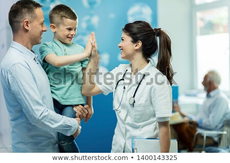 Сток-фото: Nurse Talking To Child In Corridor