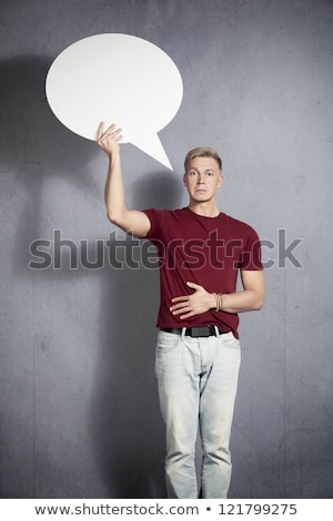 Foto stock: Disappointed Man Holding White Blank Speech Balloon