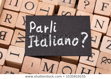 Stockfoto: Speak Italian Question On Letter Wooden Blocks