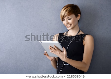 Stok fotoğraf: Young Woman Lean By The Concrete Wall