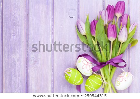 Zdjęcia stock: Easter Eggs With Purple Tulip Flowers And Gifts