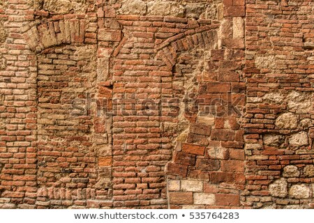 Stockfoto: The Background Of The Old Masonry And Arc With Traces Of The For