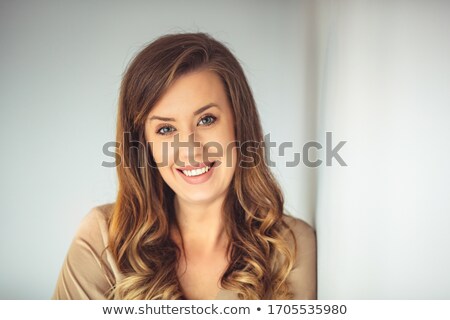 ストックフォト: Woman With Beauty Long Brown Hair Posing At Home Studio