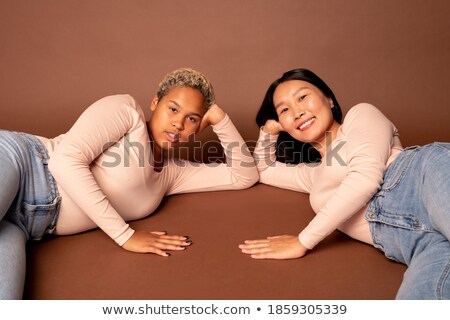 Foto d'archivio: Cute Couple Looks At You From The Floor