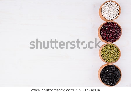 ストックフォト: Border Of Assortment Kidney Beans In A Wooden Bowls Macro With Copy Space On White Wood Background