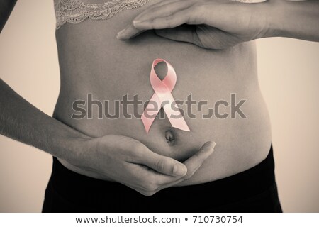 Сток-фото: Mid Section Of Woman In Bra With Breast Cancer Awareness Ribbon